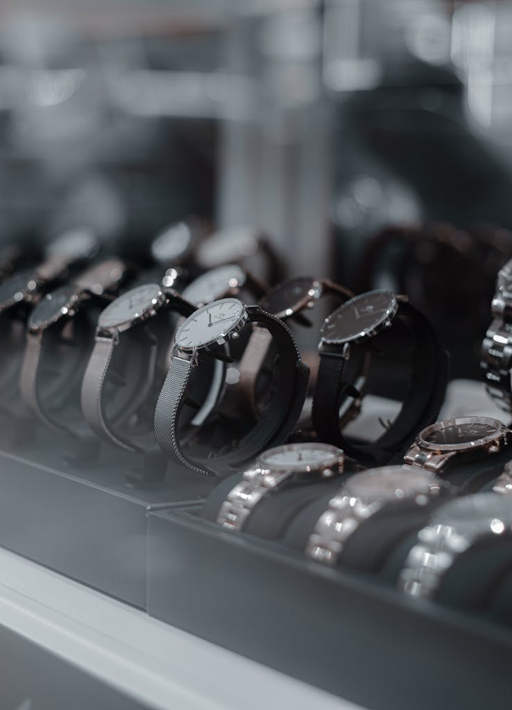 A detailed view of luxury wristwatches displayed in a store showcase, highlighting style and sophistication.